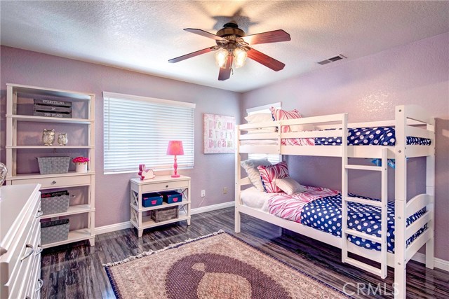 Additional large upstairs bedroom #1 with stunning flooring.