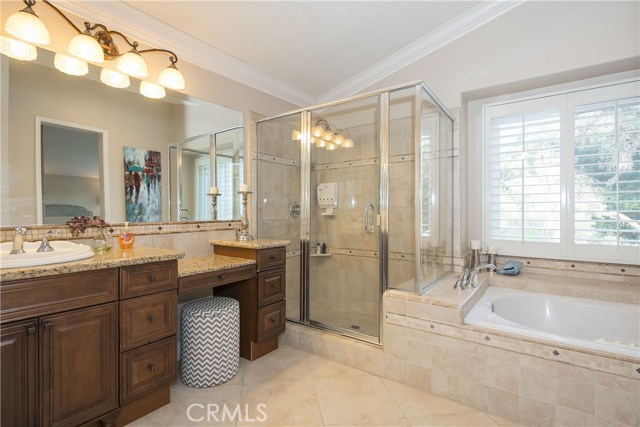 Remodeled bathroom with make-up vanity, jetted tub & separate shower.