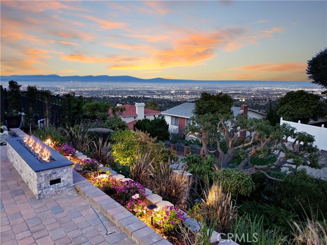 City and mountain views from large rear patio, custom fire pit, slope landscaped and lighted