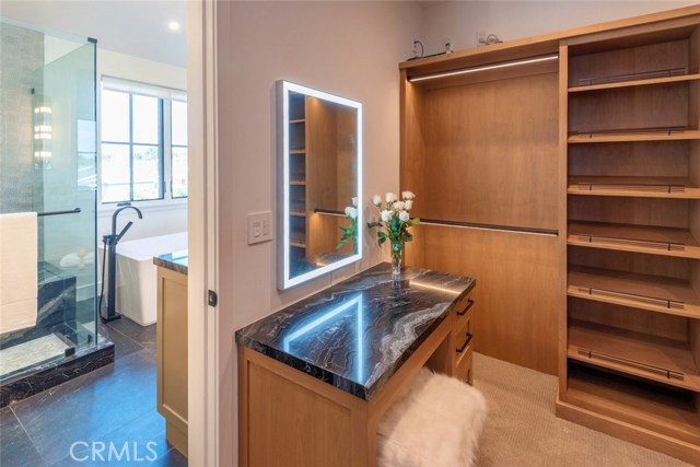 Primary bedroom walk - in closet