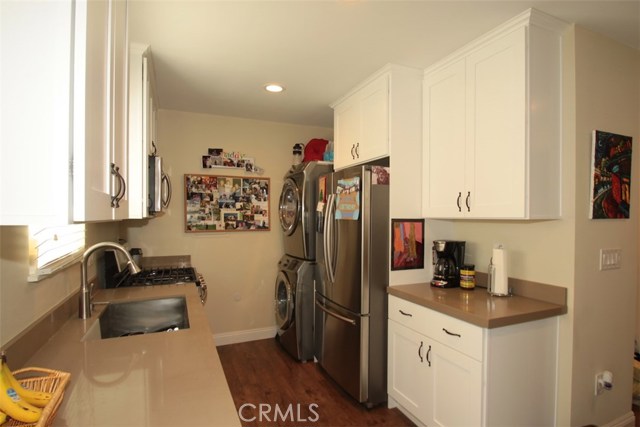 Another view of the spacious kitchen with stackable washer and dryer at the rear!