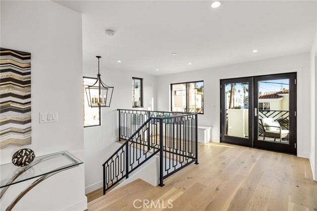 Stairway opens into built in seating and a sunny balcony