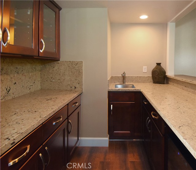 Wet bar with lots of storage and wine fridge