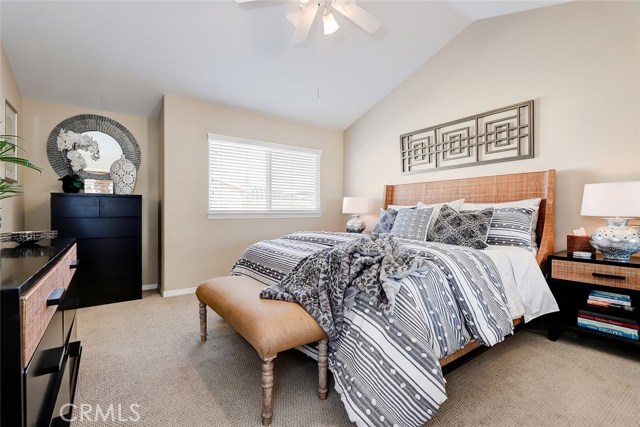Bright master bedroom with vaulted ceilings.