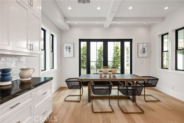 Breakfast seating poised to expand into the lushly landscaped back yard