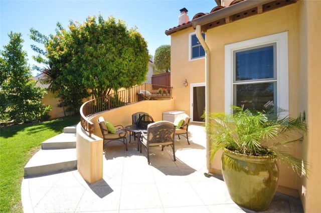 Private Patio for Downstairs 4th Bedroom.  BOYS BBQ & HOOPS Patio is up and around the sidewalk.