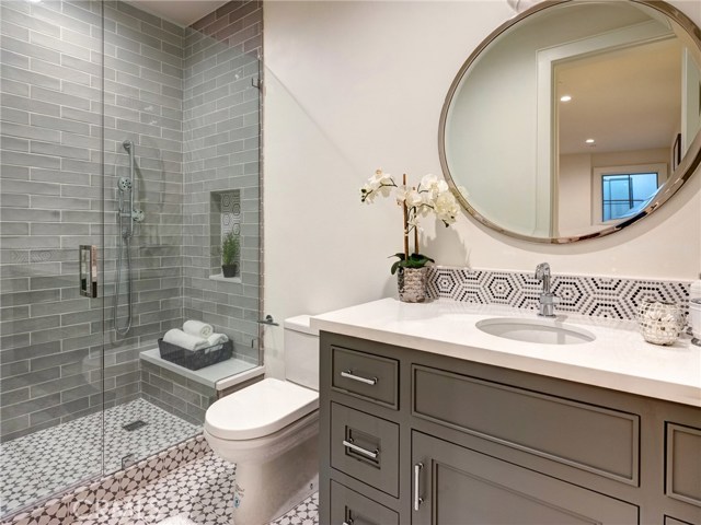 Basement bedroom en-suite bathroom with walk-in shower.