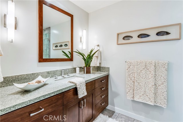 Guest bath with dual shower heads.