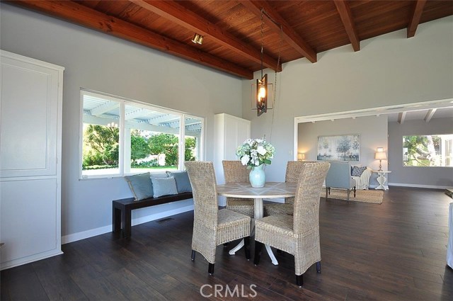 Family room with built-in cabinets looking towards the living room and front door.