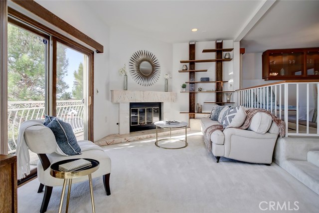 Living Room.  Steps up to the right bring you to the dining room, and continue to the right into the kitchen.