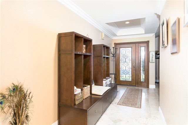 Formal entry w/ Travertine floors & Coffered ceiling Formal entry w/ Travertine floors & Coffered ceiling