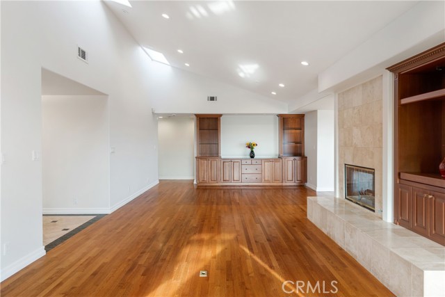 Family room with double sided fireplace. Dining area with built-ins.