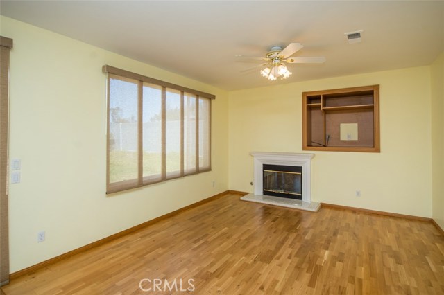 Formal family room with fire place and build in TV cabinet 
