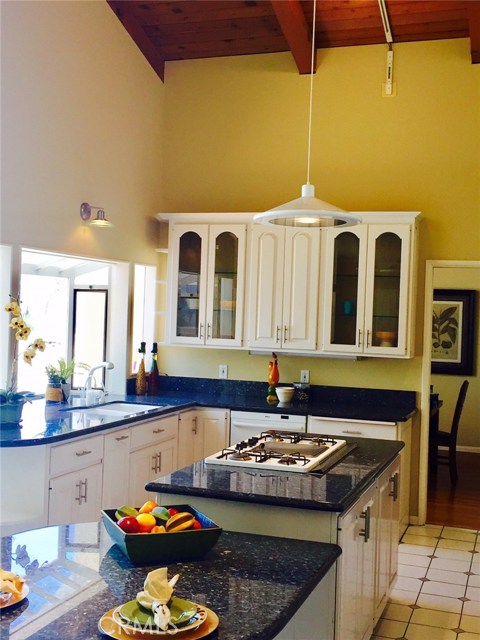 Updated kitchen has high ceilings.