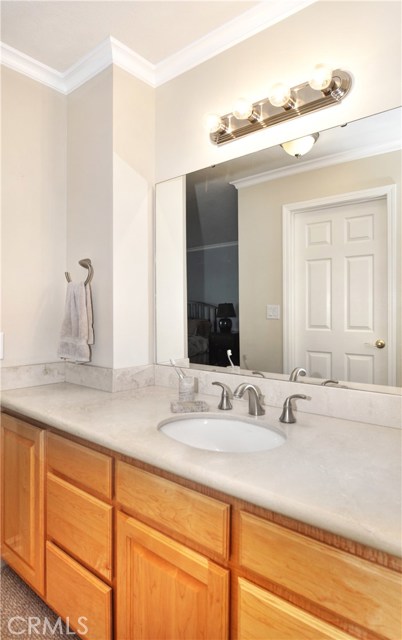 Remodeled Master Bathroom with Travertine counters and maple cabinets