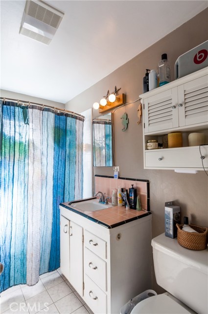 Bathroom has tiled floors and upgraded tub/shower tile. Nice vanity and decent storage.