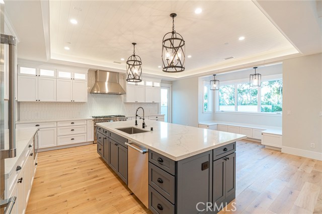 View of kitchen island and built-in breakfast nook.