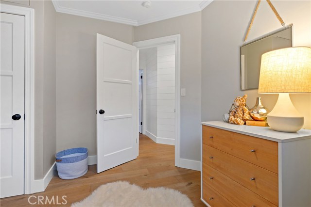 Bedroom #3 - Bedroom #2 - Gorgeous hardwood floors, crown molding and baseboards, subtle and soothing color palette, and lighting by Rejuvenation.