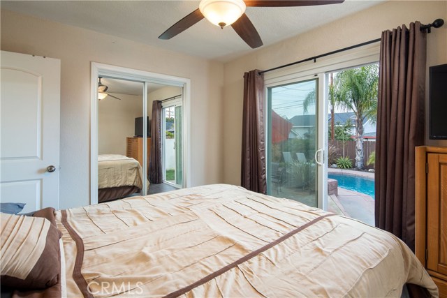 Bedroom #2 with a great view of the backyard and pool.