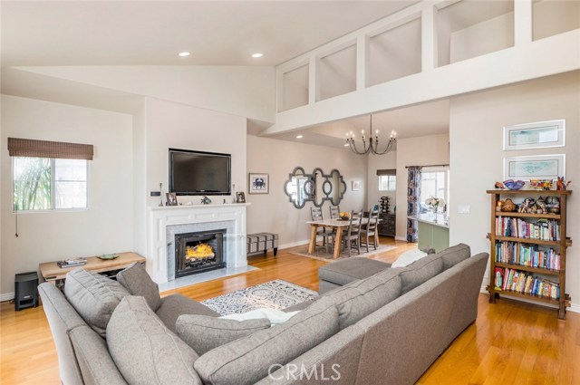 The living area connects with dining area and kitchen.