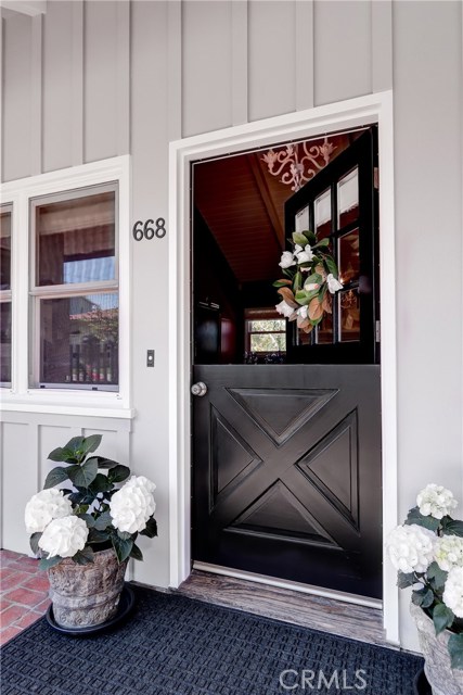 Loaded with charm, this welcoming dutch door provides a glimpse of what's to come!