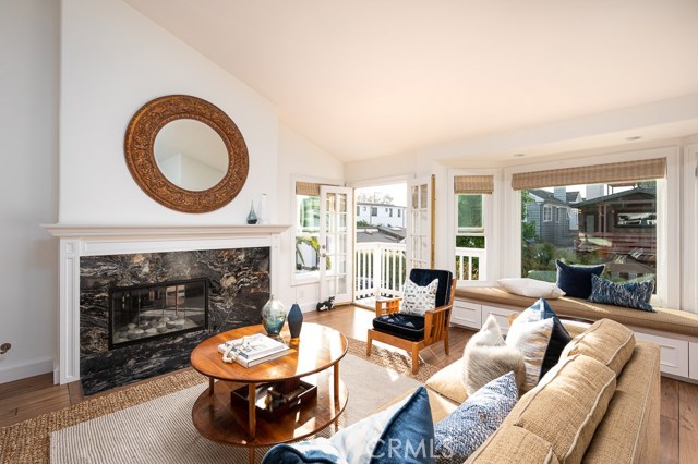 Living room features bay window and balcony