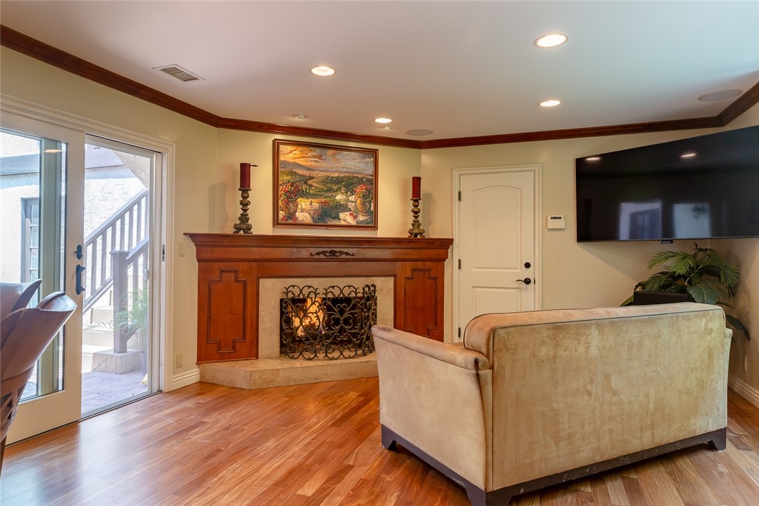 Family room.  Wood burning fireplace. 
Sliding door leads to outdoor patio.  Single door leads to garage