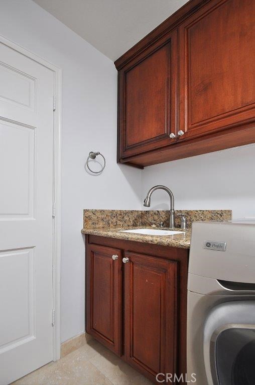 Laundry Room with beautiful cabinets and Laundry Sink.