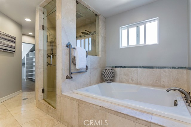 Master bathroom includes soaking tub, separate shower and heated towel racks.