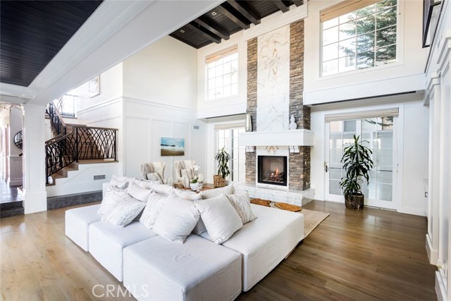 Living room with 2 story ceilings and built-ins waiting for your family photos!