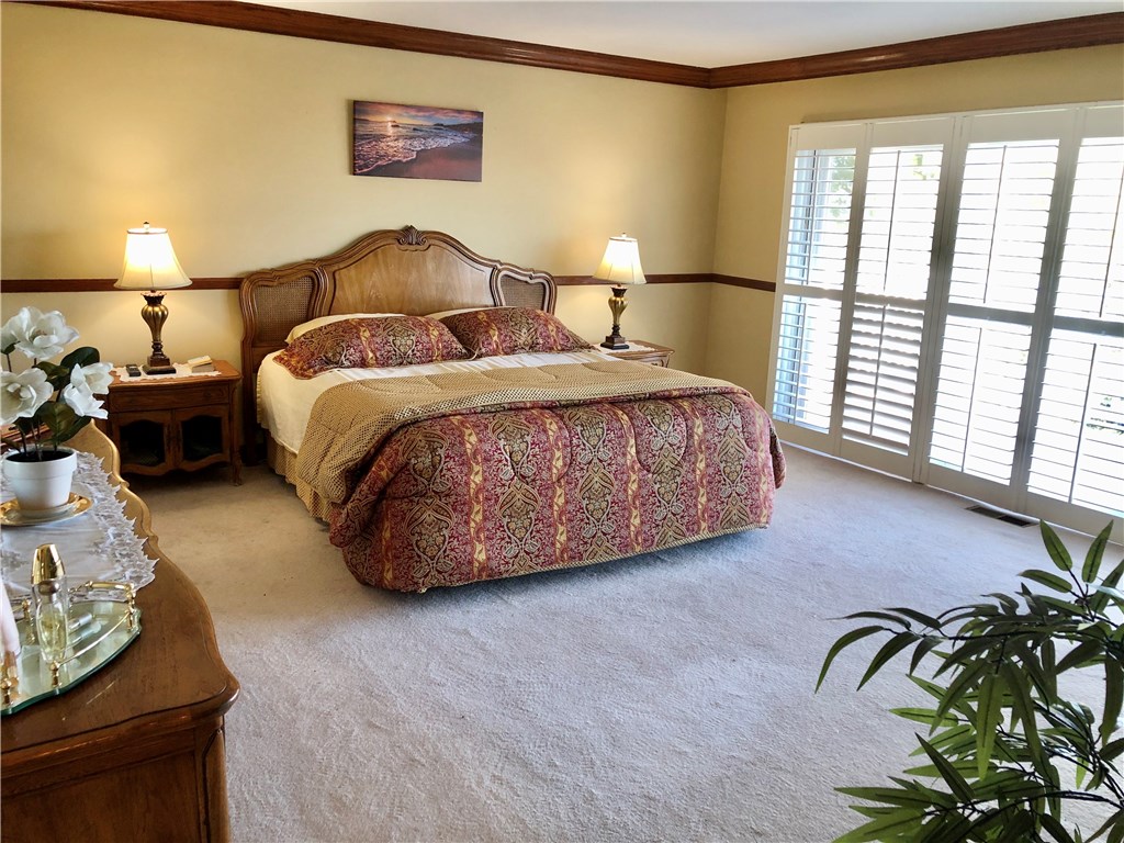 Master Bedroom with Panoramic Views lying in Bed