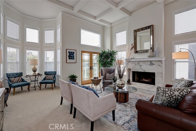 Enjoy the light, bright, and spacious living room with newly installed carpet and fresh paint throughout.