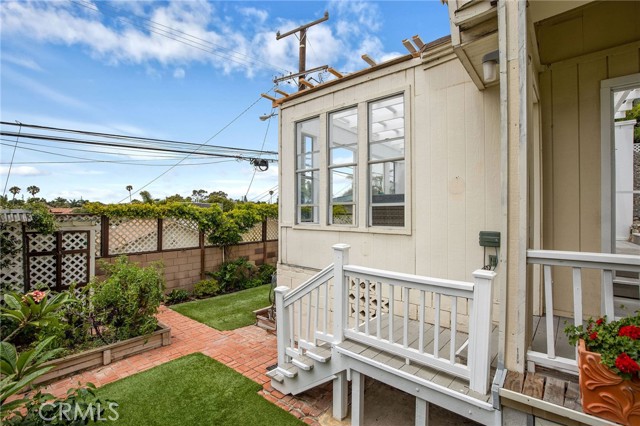 2nd level of the backyard offers gardening and play space