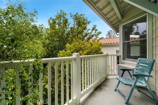 2nd level balcony off family room has Elderberry, Tangerine and Apple trees within reach. These wonderful trees provide privacy, shade and keep the house cool. There are good Palos Verdes and some ocean views from this balcony if trees were trimmed back.