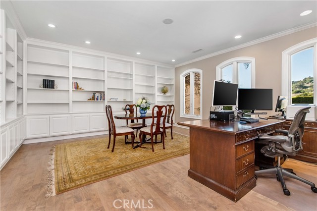 Spacious office with built in bookshelves on first floor