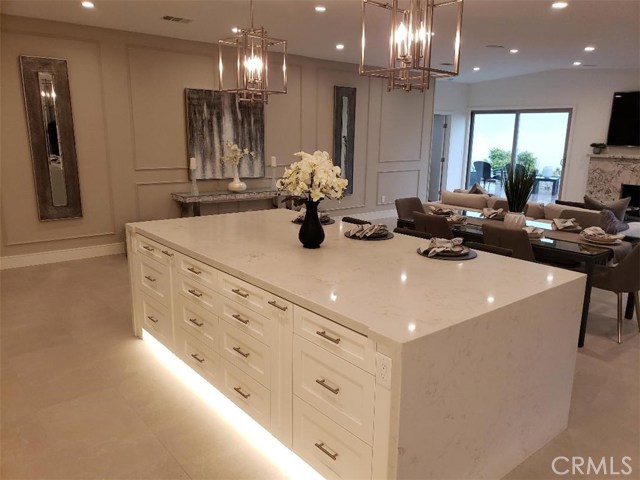 Beautiful 5' x 9' island, flooring lighting, quartz waterfall counter tops