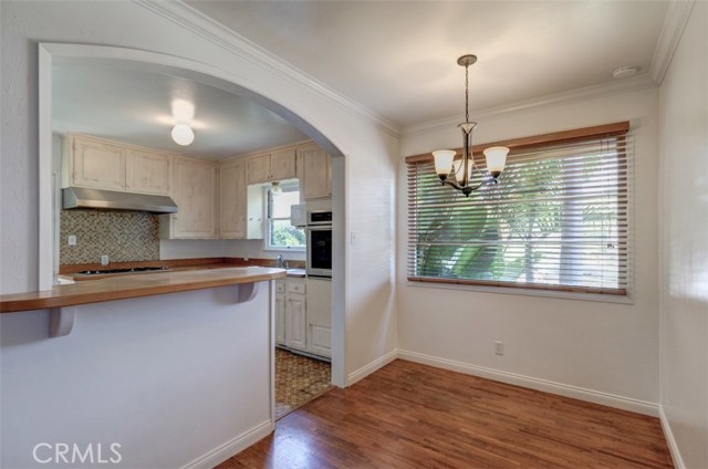 Dining room with smooth ceiling and crown molding