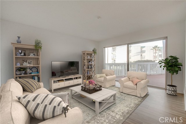 A view of how to make this house your home....lovely Virtual Staging shows the possibilities of soaking up the ocean view from your large living space!