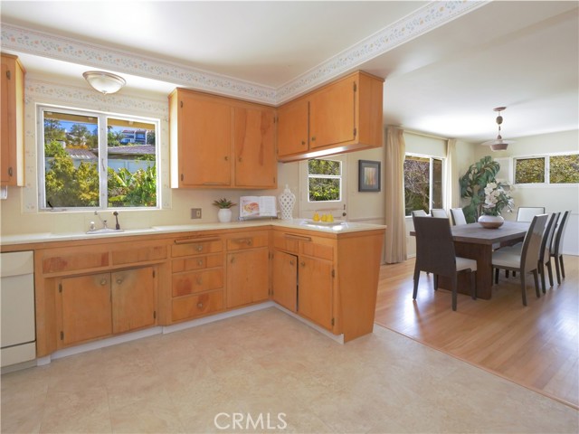 Open kitchen with lots of cabinets.