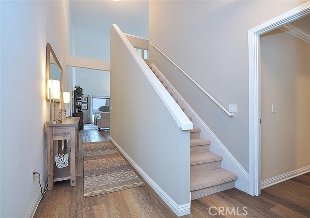 View of the staircase leading to the loft (or 3rd bedroom) and bedroom #2 and office. The opening on the right leads to a main level master bedroom suite.