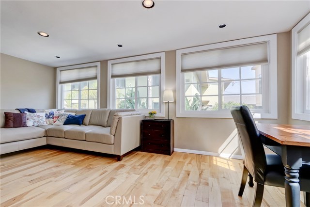 This great room adjacent to the kitchen is spacious and also used as an office!