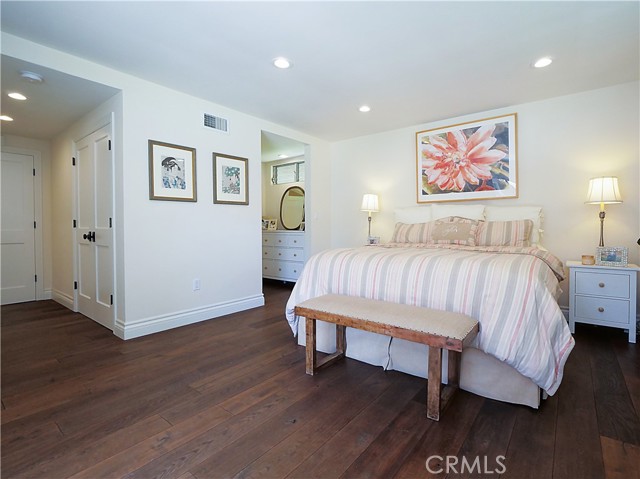 Spacious master bedroom with white oak hardwood floors