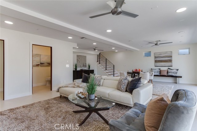 Spacious finished basement/multi-purpose great room with half bath and audio-video room. Pluming available for wet bar.