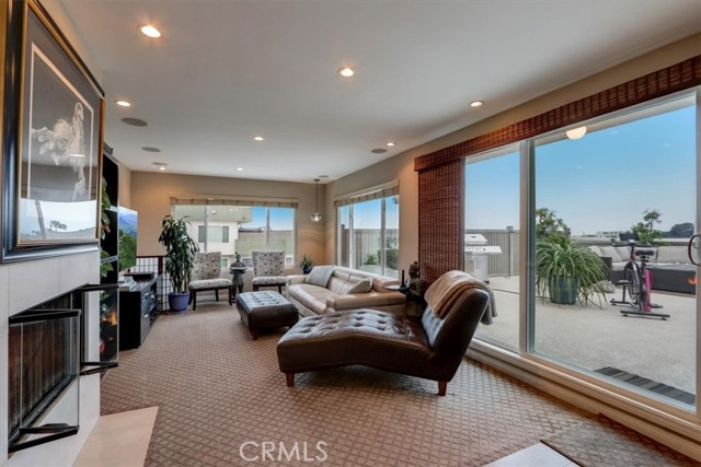 Designer carpet and a cozy fireplace envelops your living room with a ton of natural sunlight and recessed lighting for night time activities!