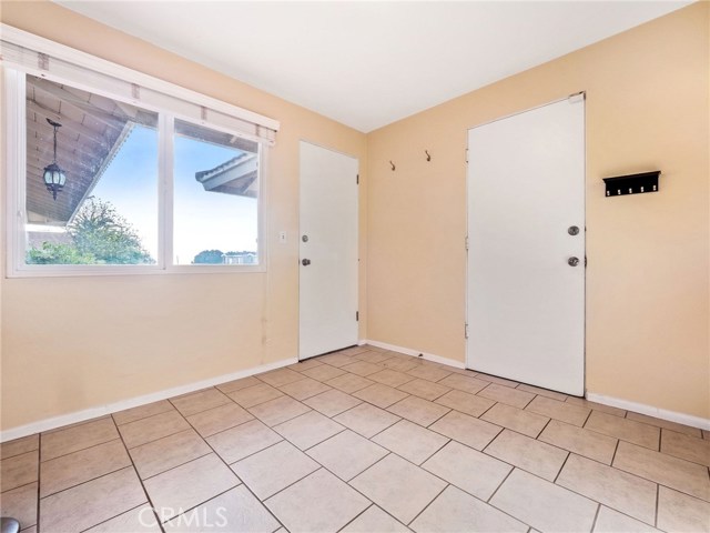 The bonus/mudroom, accessing the kitchen and the garage can serve as a spare room, home office, storage and more.