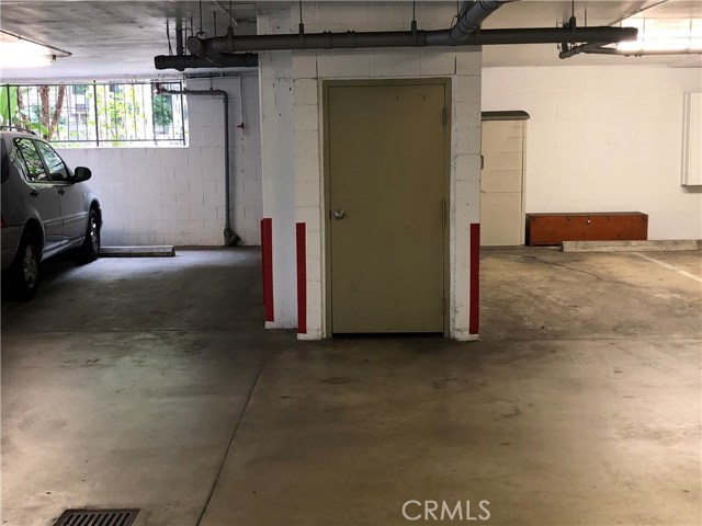 2 parking spaces, one on each side of stairway entry, and a short walk to the elevator.