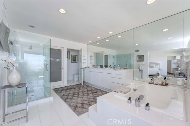 Shower, bath, dual sinks, closet, toilet room.