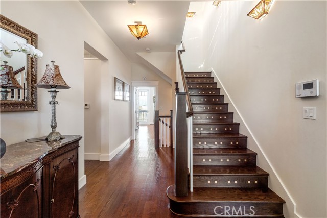 Front entrance and hallway accented by Tiffany lighting fixtures