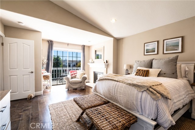 Master bedroom with cathedral ceilings, bonus area with balcony and wood burning fireplace