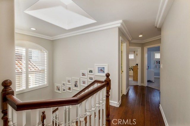 Lots of natural light coming in from the skylight and stairway window with plantation shutter